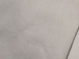 a close up of a piece of paper that has been stitched together