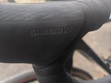 a close up of a bicycle handlebar with a blurry background