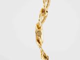 a close up of a gold necklace with a chain on it