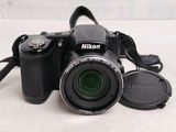a camera that is sitting on a table next to a lens