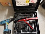 a tool kit that is sitting on the floor next to a box