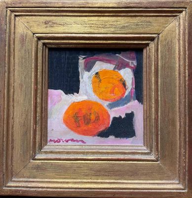 a painting of oranges in a gold frame on the wall