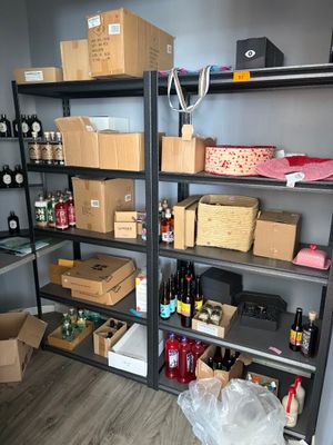 a room with a lot of boxes and boxes on the shelves
