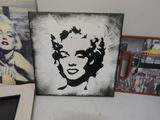 a picture of marilyn monroe on the wall next to a picture of marilyn monroe