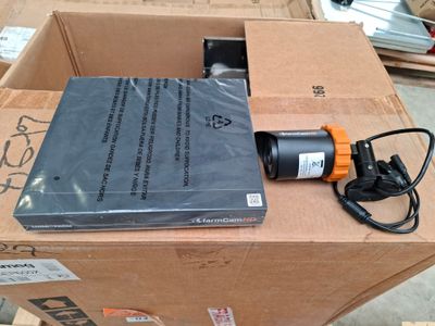 a box with a book and a power cord on top of it