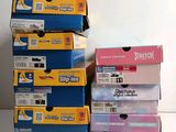 several boxes of different colors and sizes are stacked on top of each other