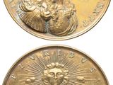 an image of two gold coins with a woman on them