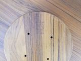 a wooden board with holes in it on a table