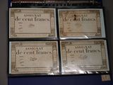 four different types of french currency are on display in a museum