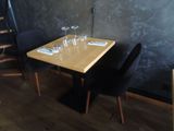 a wooden table with four wine glasses on top of it
