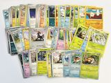 a lot of pokemon cards that are on the table