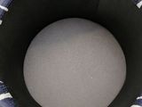 a black and white bucket with a blue and white design on it