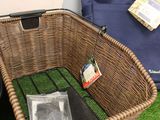 a wicker basket that is sitting on a shelf