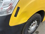 a close up of a yellow truck with a black stripe