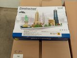 a cardboard box with a model of a city on it
