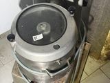 an image of a toilet with a metal tank on it