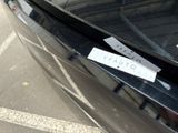 a sticker on the hood of a black car