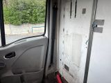 a door to a van that has a broken window