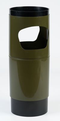 a green trash can with a hole in it