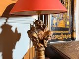 a lamp that is sitting on a table in a room