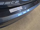 a sticker on the bumper of a car that says