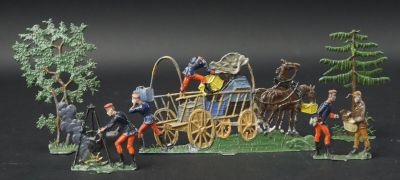 des figurines représentant un groupe de personnes assises sur le toit d'une calèche