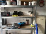 a shelf with tools on it in a garage