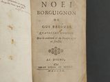 a book open on a table with writing on it