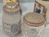 three different types of glass jars on a table