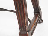a close up of a wooden table with a clock on top of it