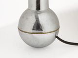 a metal object with a cord attached to it
