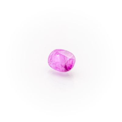 a pink sapphire stone on a white background