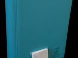 a blue binder with a white button on it