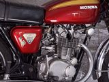a red motorcycle that is parked in a garage