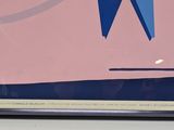 a picture of a clock with a blue ribbon on it