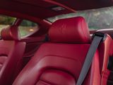a close up of a red leather seat in a car