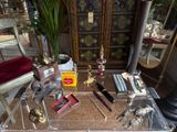 a glass table with a lot of items on top of it