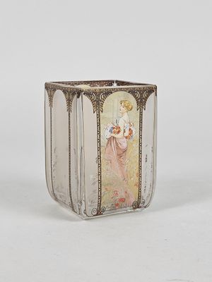 a glass vase with a picture of a woman on it