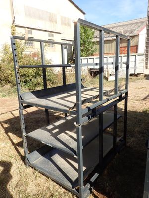 a metal shelf that is sitting in the grass