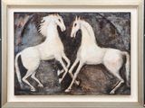 painting of two white horses in a black frame on a wall