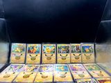 a lot of pokemon cards on the table