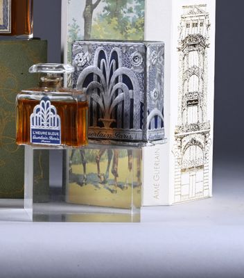 a bottle of honey sitting next to a box of books