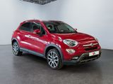 the red fiat suv is parked in a large room