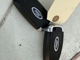 a car key that is laying on the ground