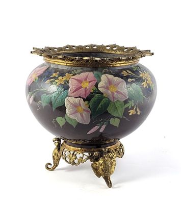a vase with flowers painted on it sitting on a stand