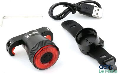 a close up of a bicycle light and a usb charger
