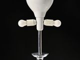a white blender that is on top of a glass stand