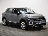 a grey volkswagen suv parked in a room with a checkered floor