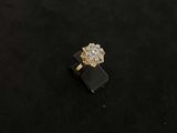a picture of a diamond ring on a black surface
