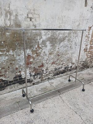 a metal rack that is on the side of a building